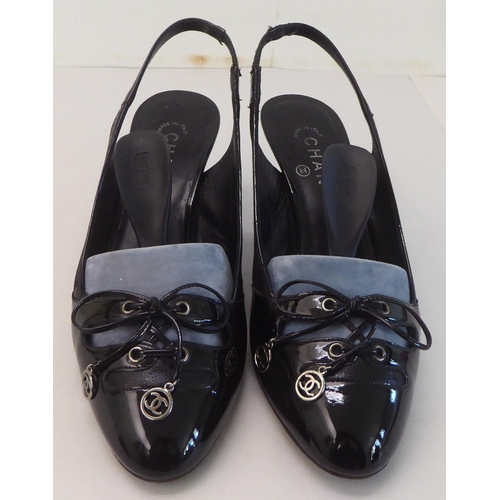 12 - A pair of ladies Gucci faux fur and black leather, low heeled shoes  size 39 with a dust bag