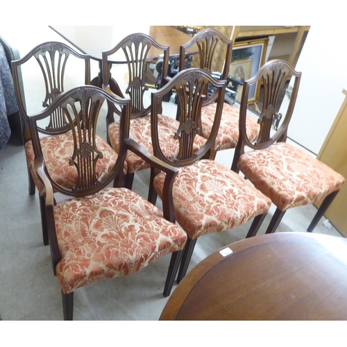 120 - A set of six Hepplewhite design mahogany framed dining chairs, the red floral patterned fabric uphol... 