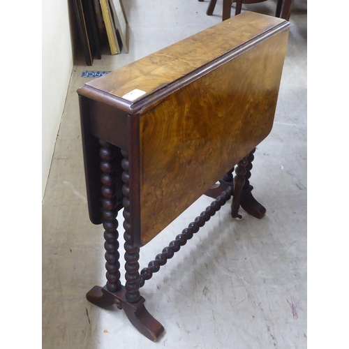 123 - An early 20thC burr walnut finished, bobbin turned mahogany Sutherland occasional table  23