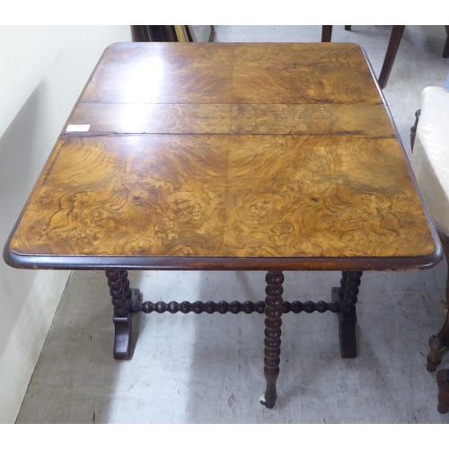 123 - An early 20thC burr walnut finished, bobbin turned mahogany Sutherland occasional table  23