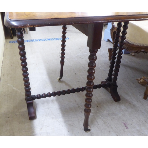 123 - An early 20thC burr walnut finished, bobbin turned mahogany Sutherland occasional table  23