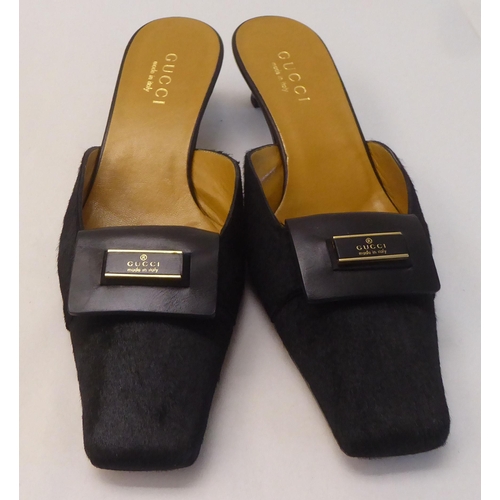 13 - A pair of ladies Gucci faux fur and black leather, low heeled sandals  size 39 with a dust bag