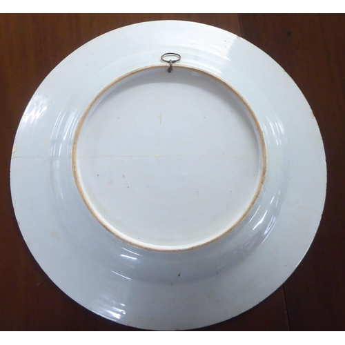 135 - 18thC and later Chinese and other Oriental ceramics: to include a porcelain charger  14