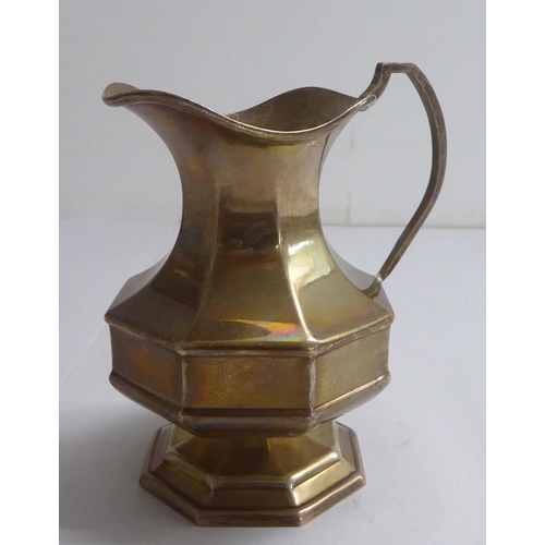 137 - Silver collectables: to include a milk jug of octagonal pedestal design  indistinct Birmingham ... 