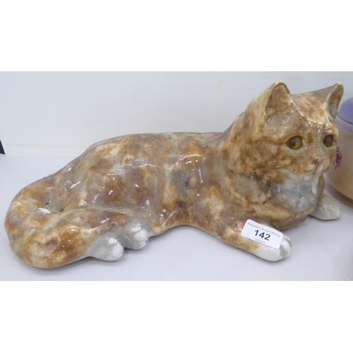 142 - Ceramics: to include a Winstanley pottery model, a Tabby cat  6.5