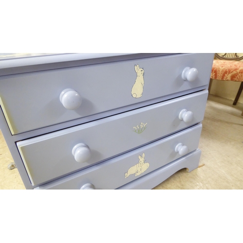 150 - A modern light blue painted and rabbit decorated, three drawer dressing chest, raised on bracket fee... 