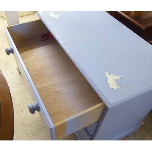 150 - A modern light blue painted and rabbit decorated, three drawer dressing chest, raised on bracket fee... 