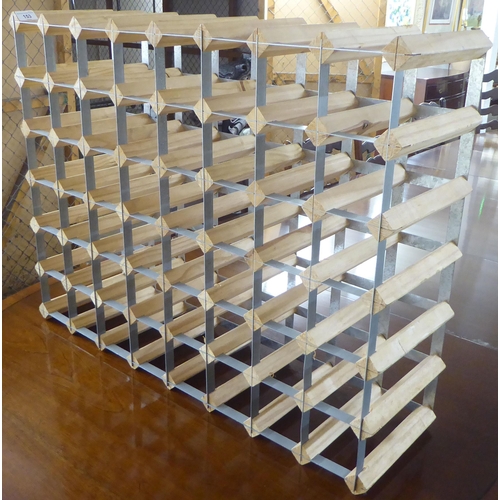 153 - A modern pine and aluminium wine rack, accommodating 56 bottles  24