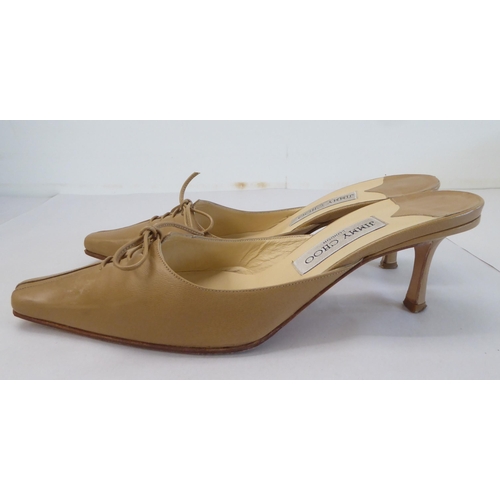 16 - A pair of ladies Jimmy Choo cream and brown leather, low heeled sandals  size 39 with a dust bag