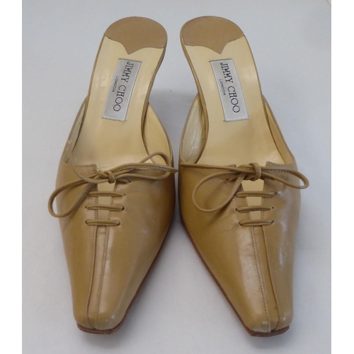 16 - A pair of ladies Jimmy Choo cream and brown leather, low heeled sandals  size 39 with a dust bag