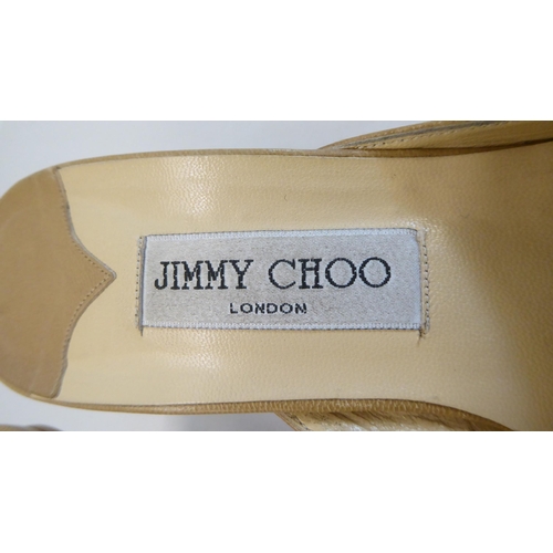 16 - A pair of ladies Jimmy Choo cream and brown leather, low heeled sandals  size 39 with a dust bag