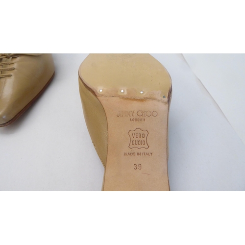 16 - A pair of ladies Jimmy Choo cream and brown leather, low heeled sandals  size 39 with a dust bag