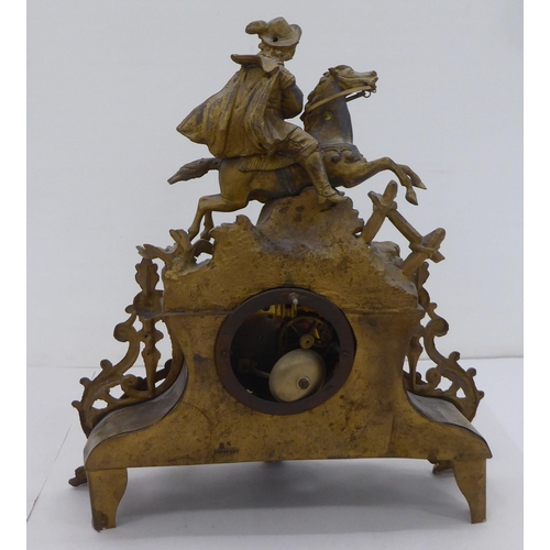 160 - An early/mid 20thC French gilded spelter mantel clock, fashioned as a cavalier on horseback; the mov... 