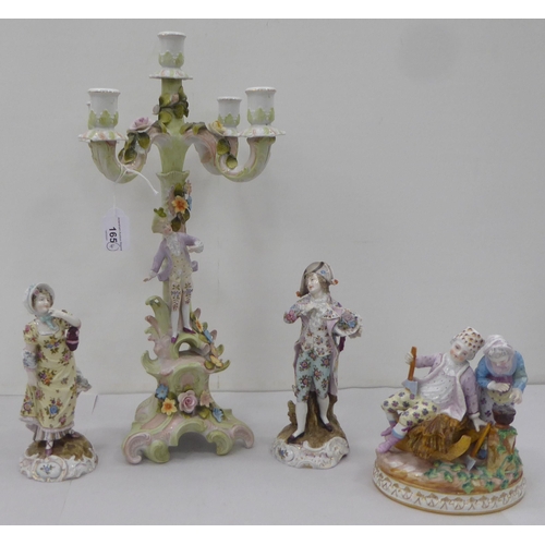 165 - Four items of 20thC Continental porcelain: to include a juvenile group  5