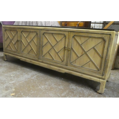 176 - A modern Chinese mahogany shabby chic finished sideboard with two pairs of panelled doors, raised on... 