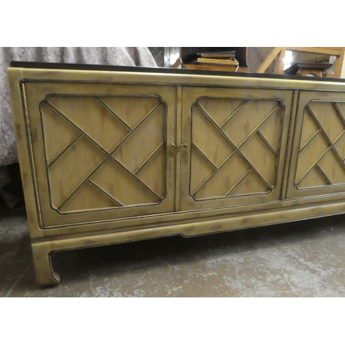 176 - A modern Chinese mahogany shabby chic finished sideboard with two pairs of panelled doors, raised on... 