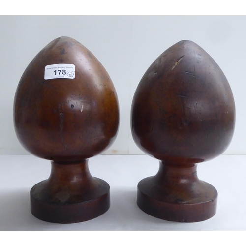 178 - A pair of late 18thC turned mahogany acorn shape post finials  10.5