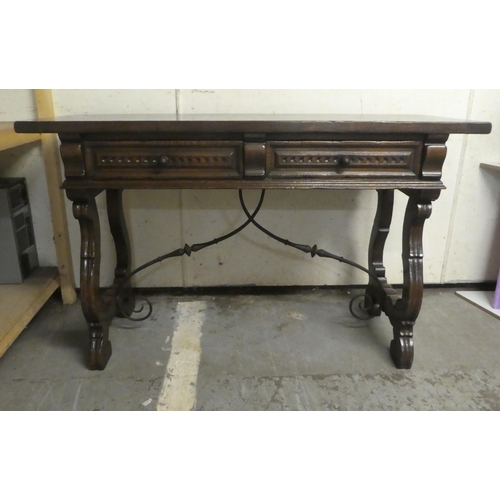 180 - A traditional Spanish style 19thC style oak two drawer serving table, raised on lyre shaped pierced ... 