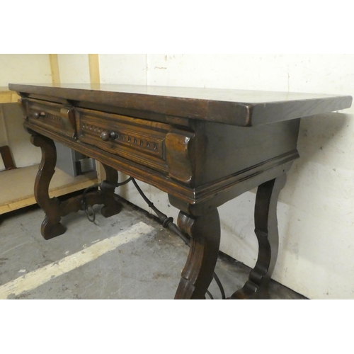 180 - A traditional Spanish style 19thC style oak two drawer serving table, raised on lyre shaped pierced ... 