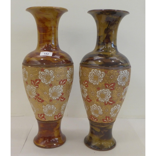 182 - Two similar late Victorian Doulton Lambeth stoneware vases, each decorated with lace pressed flora&n... 