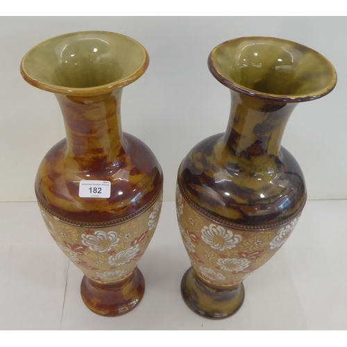 182 - Two similar late Victorian Doulton Lambeth stoneware vases, each decorated with lace pressed flora&n... 