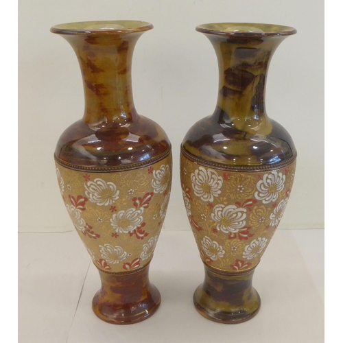 182 - Two similar late Victorian Doulton Lambeth stoneware vases, each decorated with lace pressed flora&n... 