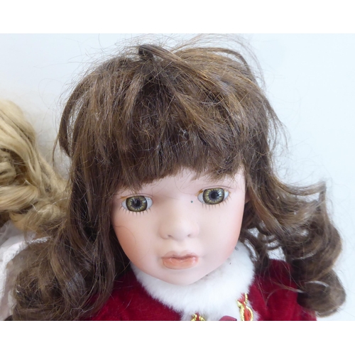 185 - Dolls: to include a porcelain head example, on a fabric body  20