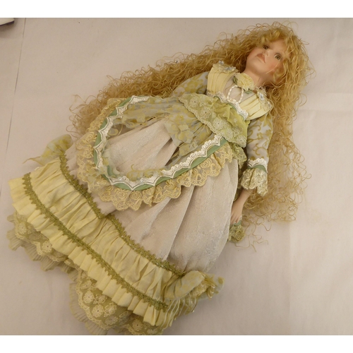 185 - Dolls: to include a porcelain head example, on a fabric body  20