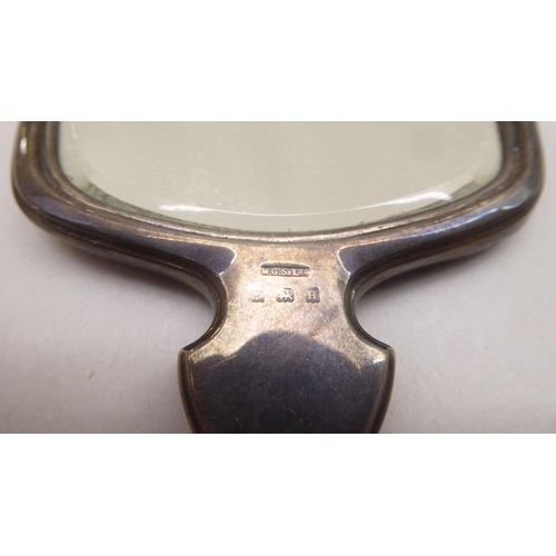 193 - Silver collectables: to include a hand mirror with engine turned decorated  indistinct marks&nb... 