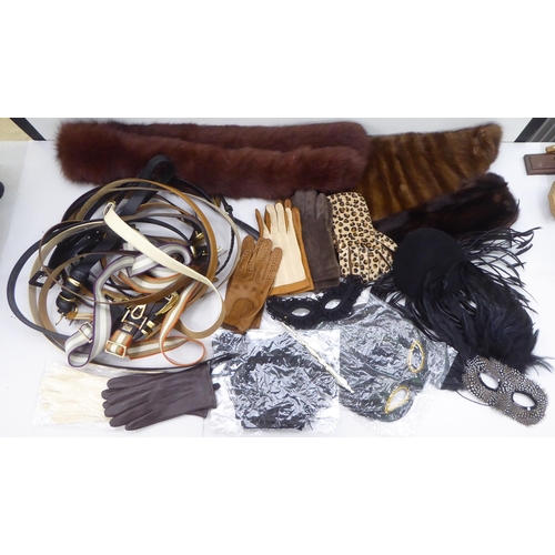 198 - Ladies accessories, viz. gloves, belts, masks, fur and a black feather hat: to include Donna Karin, ... 