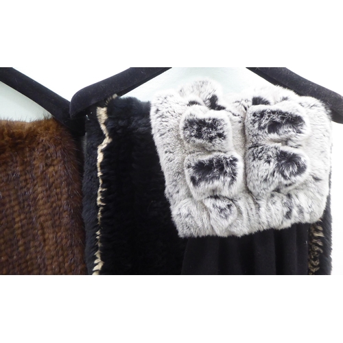 204 - Two fur wraps; and an N Peal black cashmere and fur stole 