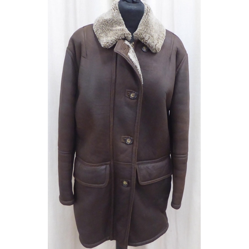 206 - A lady's Gucci brown leather faux fur lined 'car coat'  approx. size 14