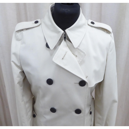 212 - A lady's Aquascutum mid length stone coloured raincoat  size 8