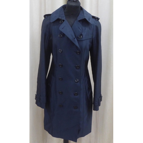 213 - A lady's Burberry 'slim fit' mid length deep blue satin finished coat  size 8