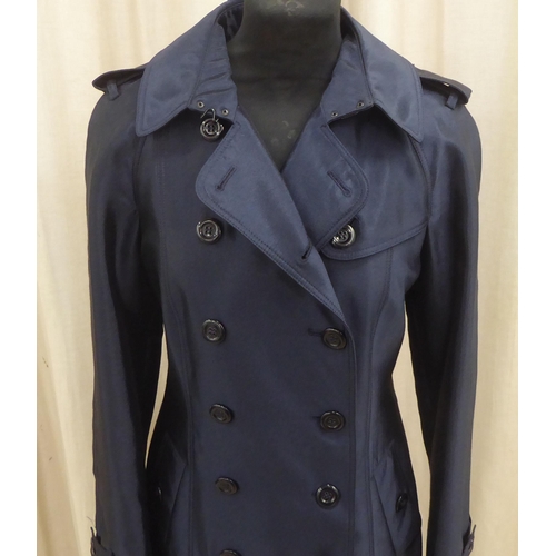 213 - A lady's Burberry 'slim fit' mid length deep blue satin finished coat  size 8