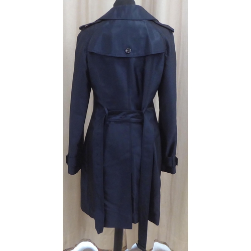 213 - A lady's Burberry 'slim fit' mid length deep blue satin finished coat  size 8