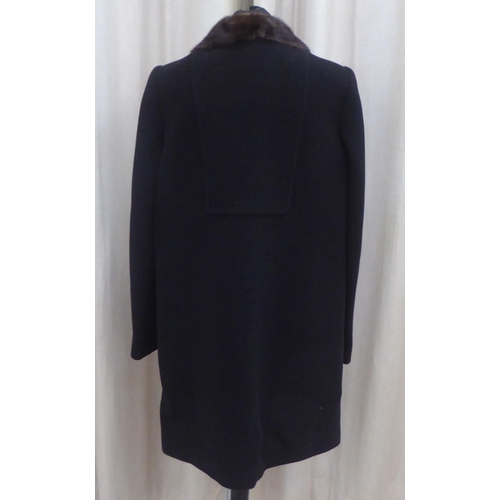 216 - A lady's Dolce & Gabbana mid-length black wool/cashmere coat with a detachable mink collar ... 