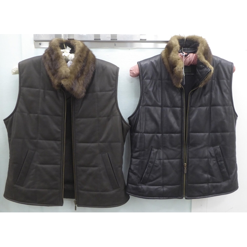 223 - Two ladies Hide Park leather gilet, one in brown, the other black, both with mink collar trim  ... 