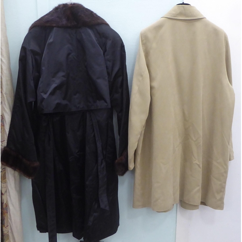 226 - A lady's Ramo Wear full length black fabric coat with a mink collar and cuffs  approx. size 10; and ... 