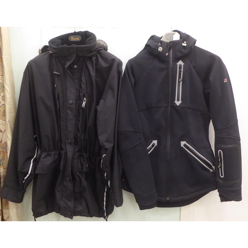 228 - A lady's Sweaty Betty black rainproof jacket  size XS; and a DKNY Active black fabric jacket wi... 