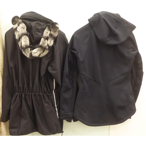 228 - A lady's Sweaty Betty black rainproof jacket  size XS; and a DKNY Active black fabric jacket wi... 