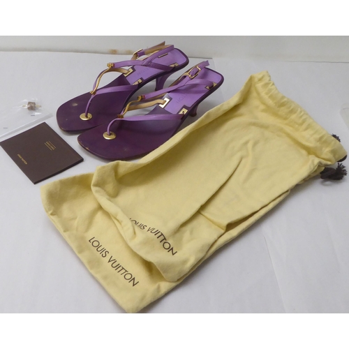 23 - A pair of ladies Louis Vuitton two tone purple leather, low heeled, open toe shoes  size 40.5 with a... 