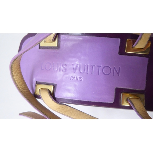 23 - A pair of ladies Louis Vuitton two tone purple leather, low heeled, open toe shoes  size 40.5 with a... 