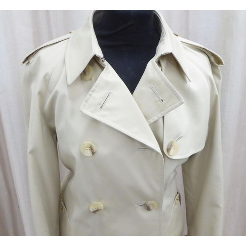 236 - A lady's Aquascutum cream coloured raincoat  size 8