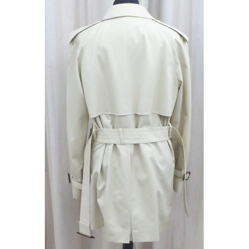 236 - A lady's Aquascutum cream coloured raincoat  size 8