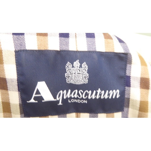 236 - A lady's Aquascutum cream coloured raincoat  size 8