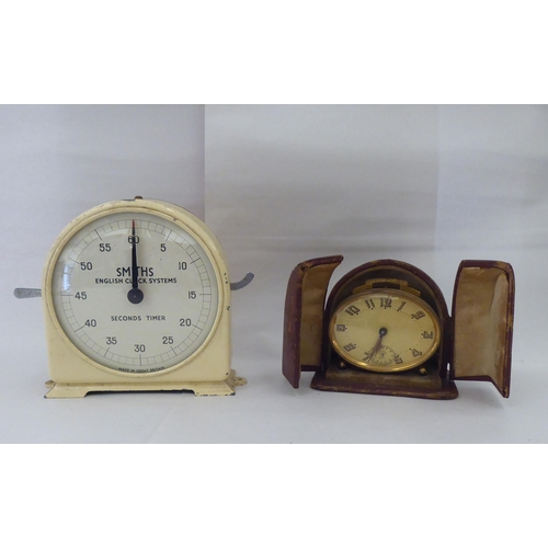 244 - Ten dissimilar early/mid 20thC clocks: to include an Edwardian string inlaid mahogany cased example ... 