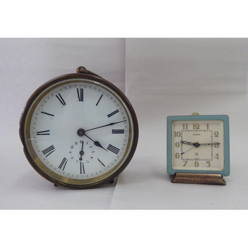 244 - Ten dissimilar early/mid 20thC clocks: to include an Edwardian string inlaid mahogany cased example ... 