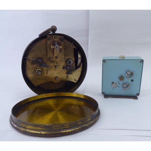 244 - Ten dissimilar early/mid 20thC clocks: to include an Edwardian string inlaid mahogany cased example ... 