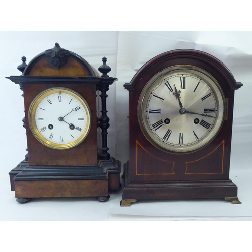 244 - Ten dissimilar early/mid 20thC clocks: to include an Edwardian string inlaid mahogany cased example ... 